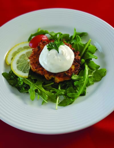 Plated food with greens and sauce