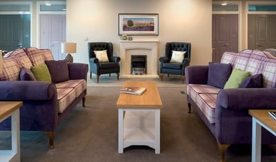 Cozy common area with seating and fireplace.