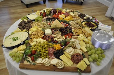 A large cheese and charcuterie platter.