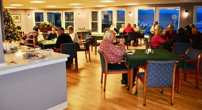 Residents enjoying activities in the dining area