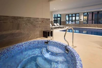Indoor spa with hydrotherapy pool and seating