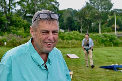 Smiling man outdoors participating in an activity