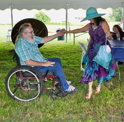 Residents enjoying a dance at an outdoor event.
