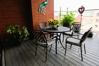 Outdoor patio with flowers and chairs