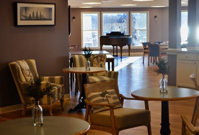 Cozy common area with seating and piano