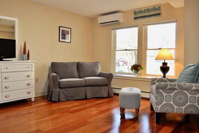 Cozy living area with comfortable seating and natural light.