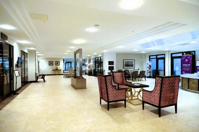Spacious common area with seating and natural light.