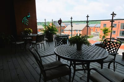Outdoor seating area with plants and decor