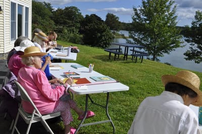 Residents engaged in an outdoor art activity