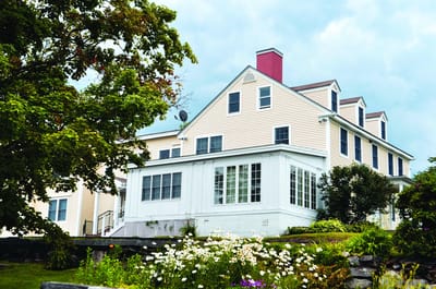 Building exterior with flowers and trees
