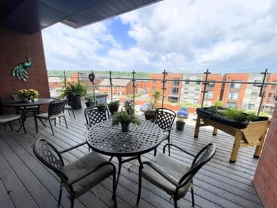 Outdoor seating area with plants and views