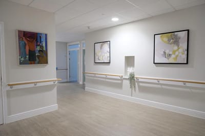 Bright interior corridor with art on the walls