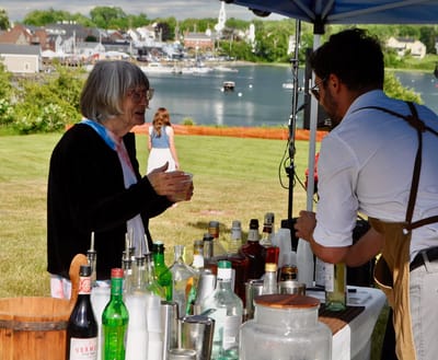 Residents enjoying a social event by the water.
