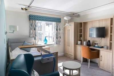 Bright resident room with modern furnishings and a window.