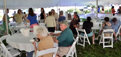 Residents enjoying a meal at an outdoor event