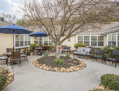 Outdoor garden area with seating and umbrellas