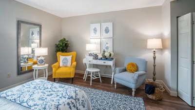 Brightly decorated resident room with furniture