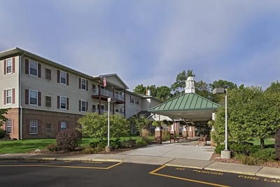 Front entrance of American House Riverview with landscaped areas