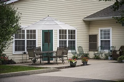 Outdoor seating area with tables and chairs