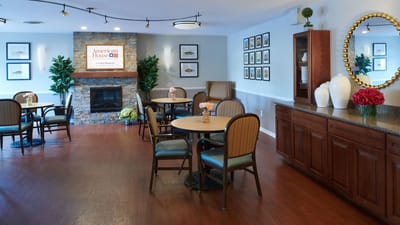 A cozy dining room area with tables and chairs