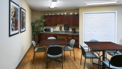 Interior view of a common area with tables and chairs