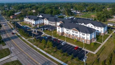 Aerial view of American House Lakeshore facility showing building and parking