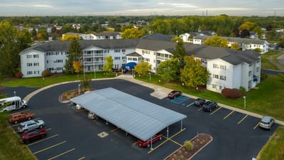 Aerial view of American House Sterling Meadows exterior and parking.