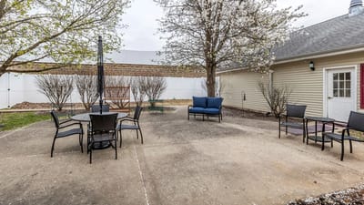 Outdoor seating area with tables and chairs
