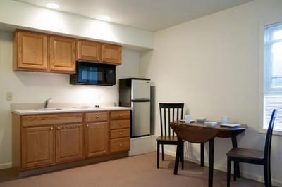 Kitchen and dining area in a resident's room