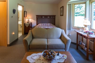 Cozy resident room with bed and seating area