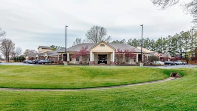 Exterior view of American House Bartlett with landscaped grounds