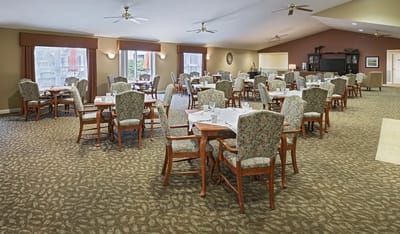 Bright dining room with tables set for meals