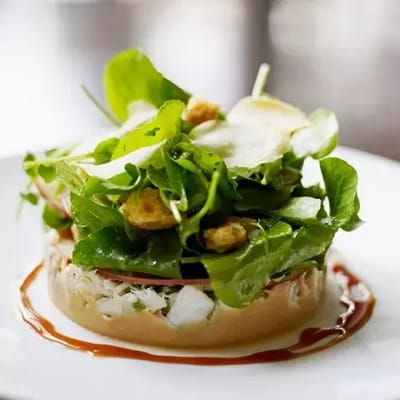 A vibrant salad served on a white plate