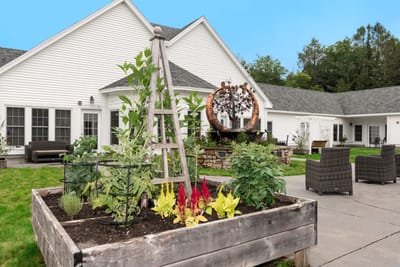 Garden area with seating and artwork