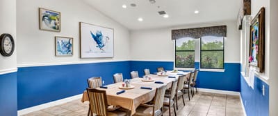 Dining room with a large table set for residents