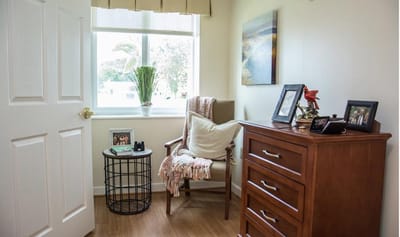 Cozy resident room with a chair and decor