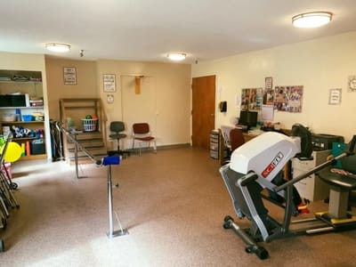 Interior view of a rehabilitation room with equipment