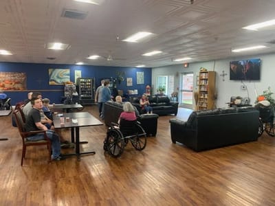 Residents and staff in a cozy common area