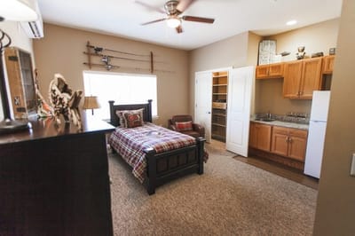 Cozy private resident room with bed and kitchenette