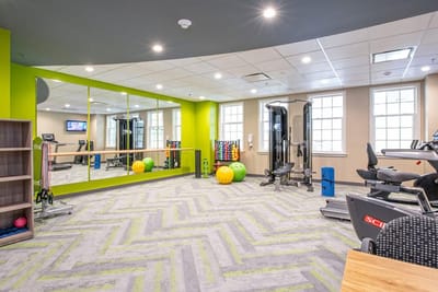 An interior view of a fitness area with equipment