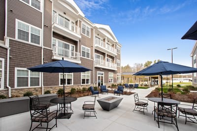 Outdoor seating area with umbrellas and lounge chairs