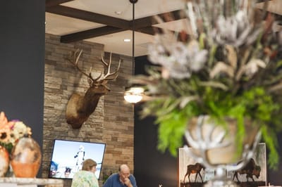 Residents engaged in conversation in a cozy common area