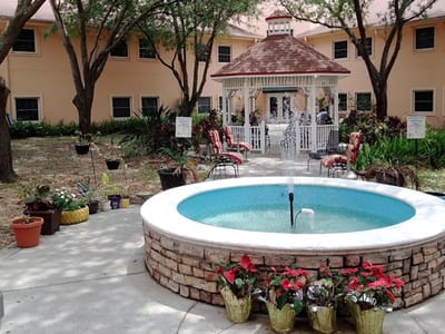 Outdoor courtyard with a gazebo and fountain