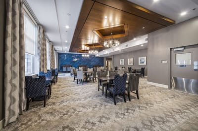 Modern dining room setup with tables and chairs