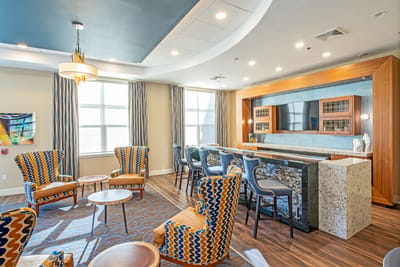 Bright common area with modern seating and decor