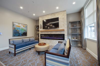 Well-furnished common area with a cozy seating arrangement