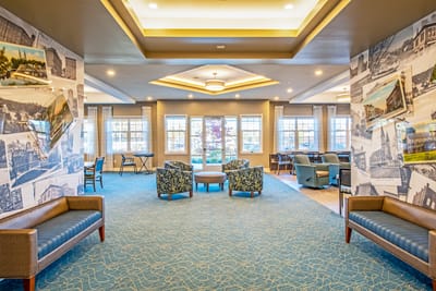 Bright common area with seating and photographs