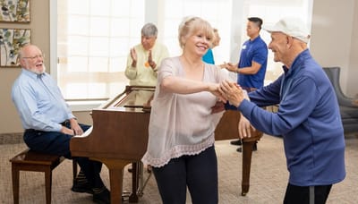Residents enjoying a dance activity in a common area