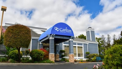 Exterior view of Carlton Senior Living facility entrance