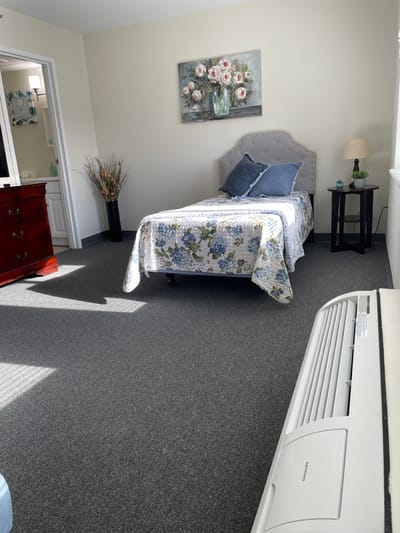 A well-furnished private resident room with decor